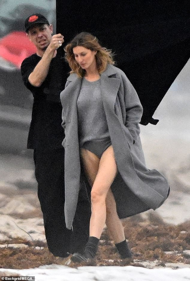 Gisele Bundchen flashes her underwear as she forgoes trousers for beach photoshoot after breaking down in tears over Tom Brady divorce