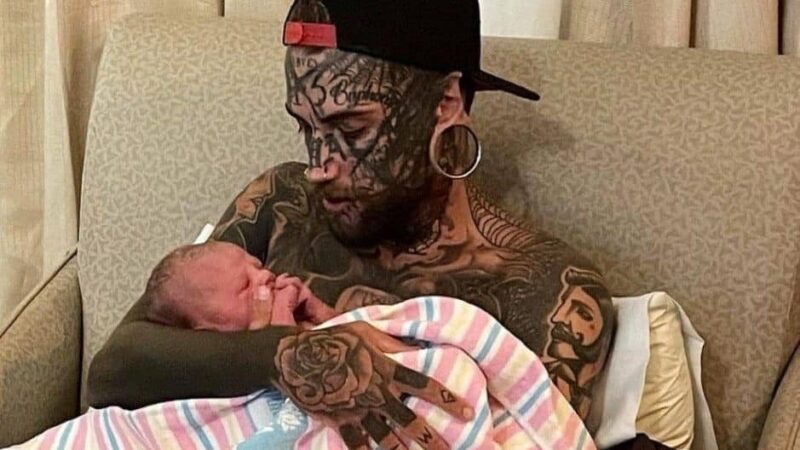 A 24-year-old father, adorned with numerous tattoos across his body, chooses to have them removed for the sake of his child.