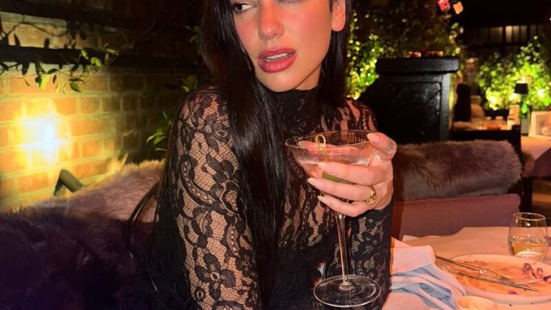 Dua Lipa Seemingly Confirms Engagement to Callum Turner, Flashing Diamond Signet Ring On *That* Finger